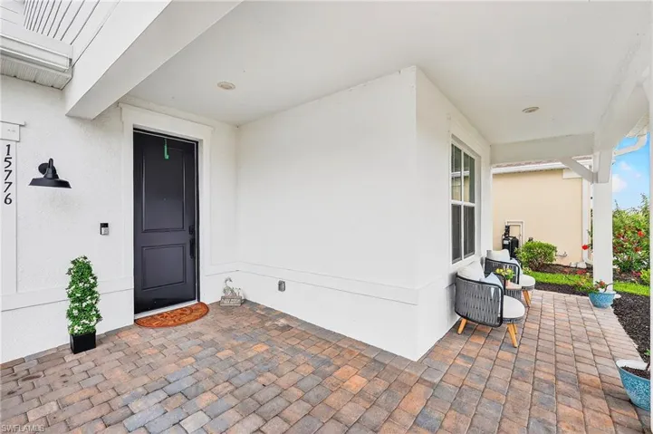 View of exterior entry featuring stucco siding