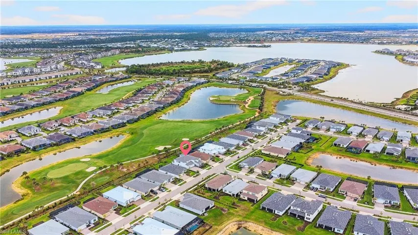 View of property location featuring nearby suburban area and a nearby body of water