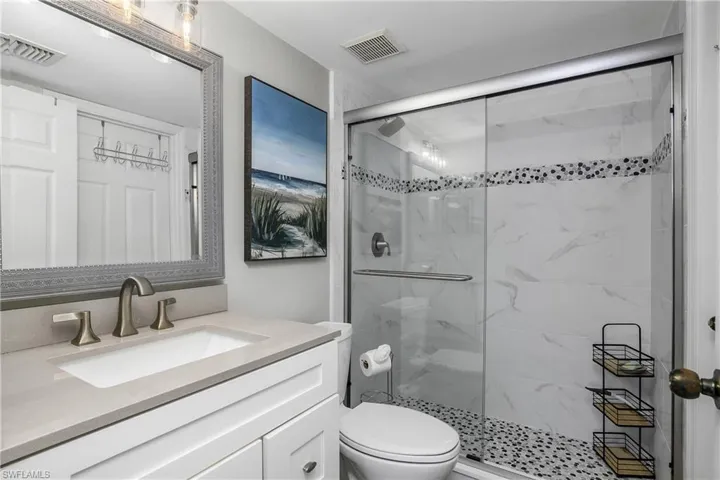 The guest bedroom also has an ensuite bathroom, with an updated vanity and a new tile walk in shower.