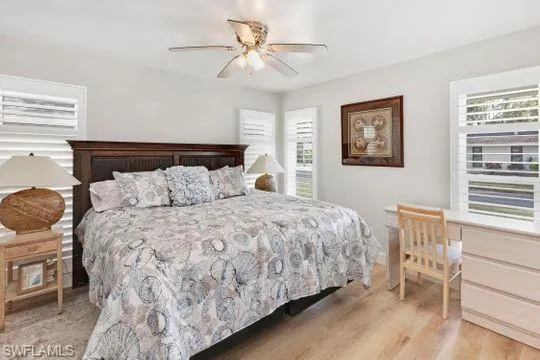Bedroom featuring a ceiling fan and light wood-type flooring