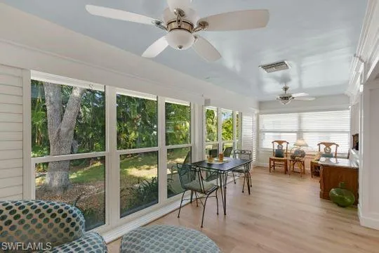 Sunroom with wood finished floors
