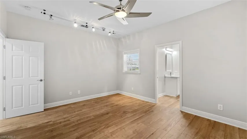 Guest bedroom #2 with ensuite/pool bathroom leading out to pool area