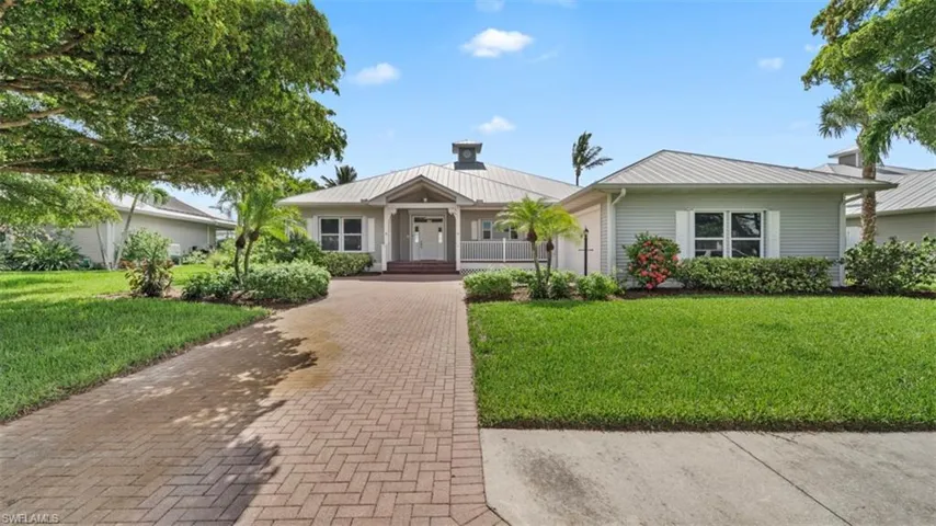 Single story home featuring a front yard