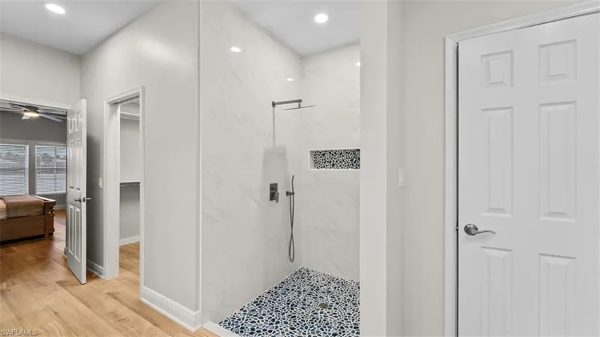 Primary bathroom with walk-in closet and 2 additional closets and water closet