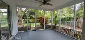 Unfurnished sunroom with a ceiling fan