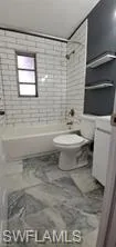 Full bathroom featuring shower / bath combination and vanity