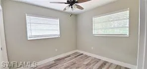 Unfurnished bedroom featuring a closet, light wood finished floors, and ceiling fan