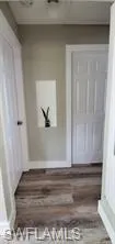 Hallway featuring wood finished floors