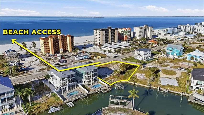 Drone / aerial view of a nearby body of water and apartment complex - Virtually Edited Image