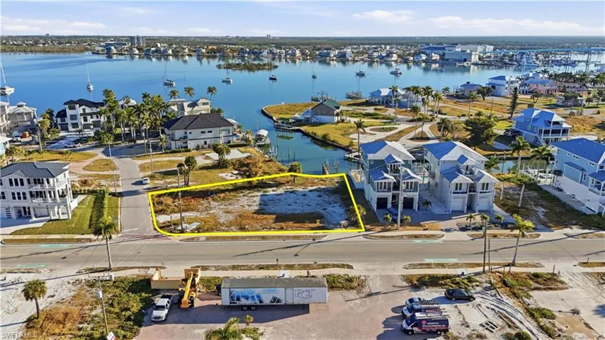 Aerial perspective of suburban area with a large body of water - Virtually Edited Image