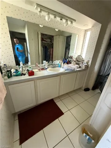 Bathroom with vanity and tile patterned flooring