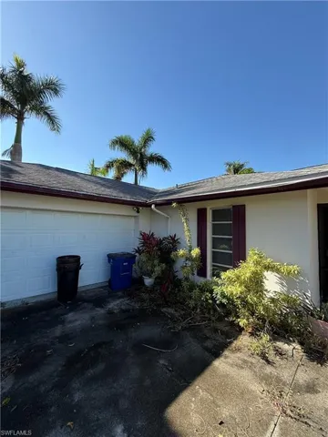 View of property exterior with a garage