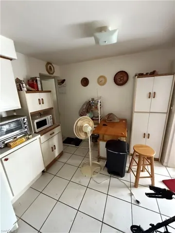Kitchen with white cabinetry