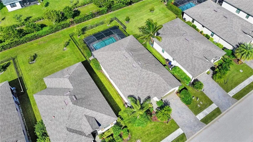 Overhead Aerial View Highlighting the Private Pool, Spacious Backyard, and Property Layout.