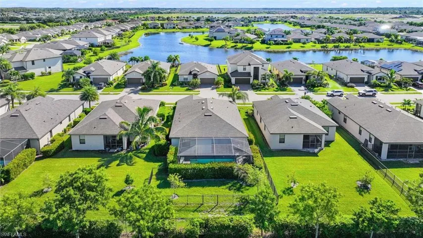 Wide-Angle Aerial View Highlighting the Property’s Location Among Beautiful Homes and Expansive Water Views.
