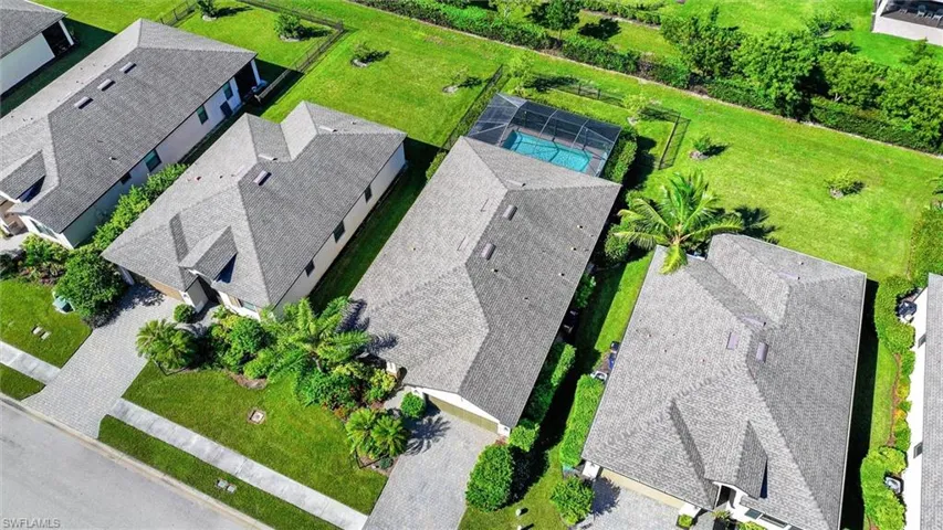 Overhead Aerial View Highlighting the Private Pool, Spacious Backyard, and Property Layout.
