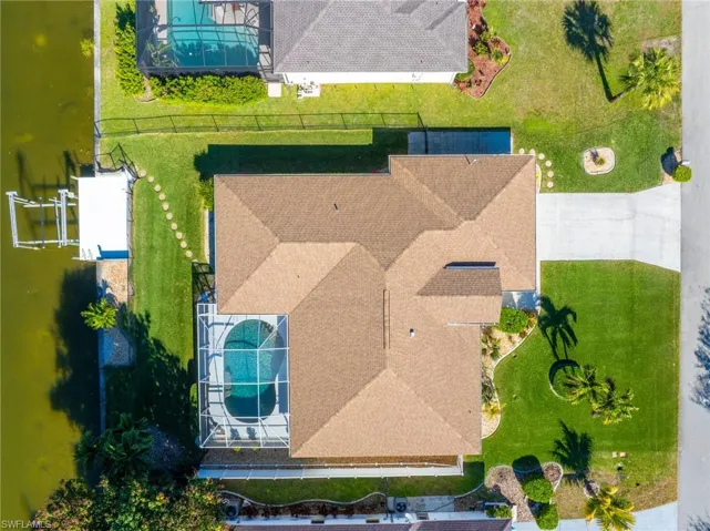 View of subject property with a pool