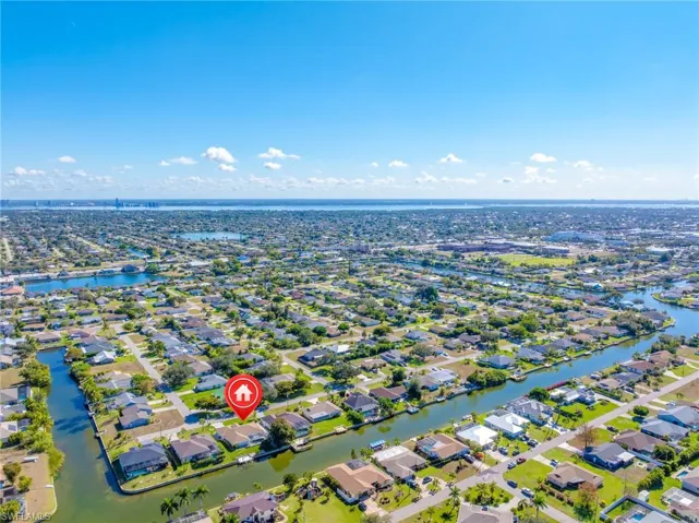 Aerial perspective of suburban area with a large body of water