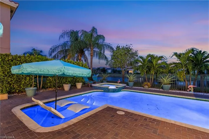 Relaxing pool / spa featuring a fenced backyard and a patio area