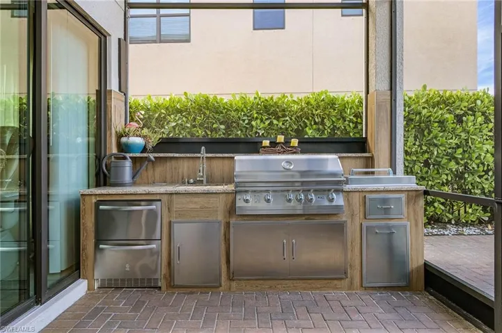 View of patio with an outdoor kitchen
