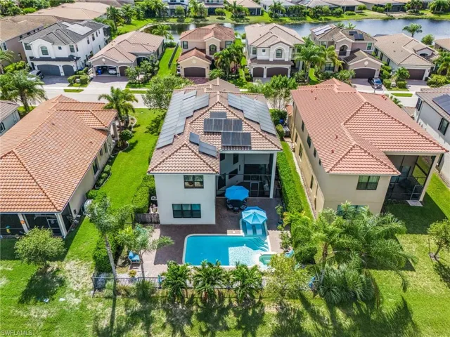 Aerial view of residential area with a nearby body of water