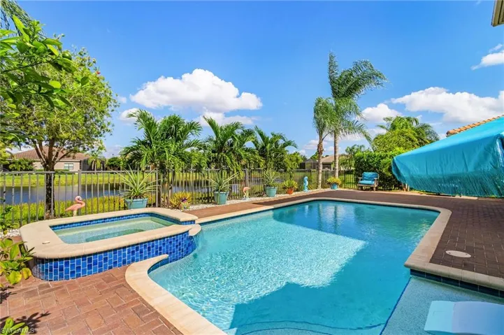 Relaxing pool / spa featuring a fenced backyard and a patio area