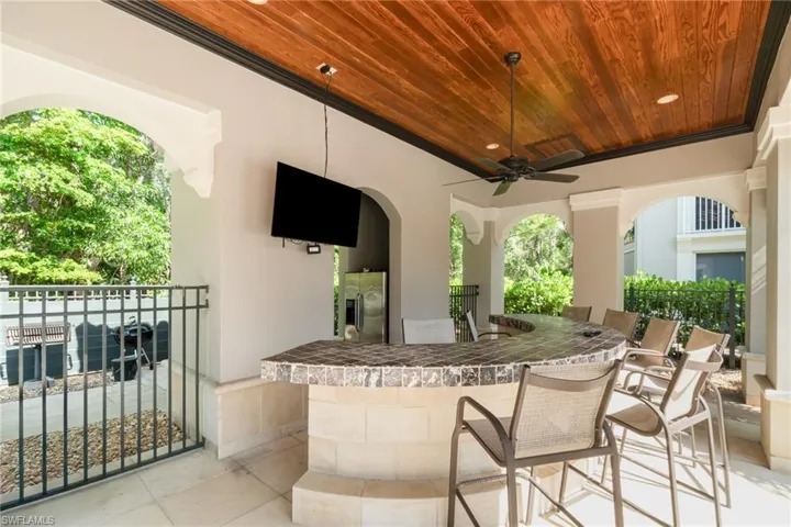 View of patio featuring ceiling fan