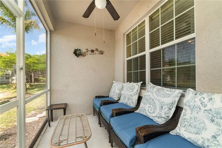 Sunroom / solarium with a ceiling fan