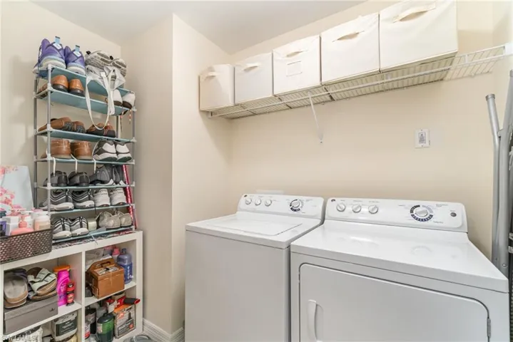 Washroom featuring independent washer and dryer