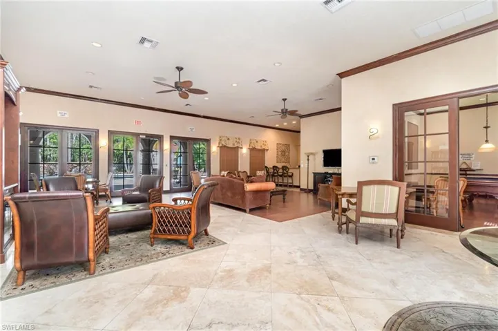 Living area featuring ornamental molding, a ceiling fan, and recessed lighting