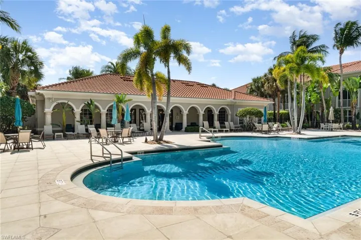 Community pool featuring a patio