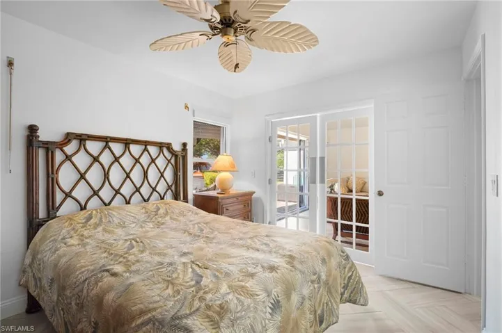 Bedroom featuring access to outside and ceiling fan