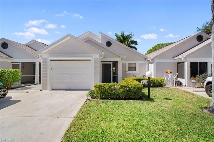 Single story home with a front yard, driveway, and an attached garage