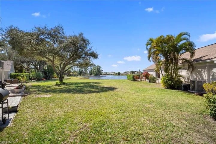 View of grassy yard featuring a water view