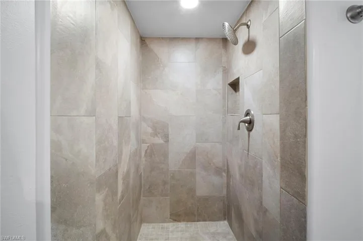 Bathroom featuring tiled shower