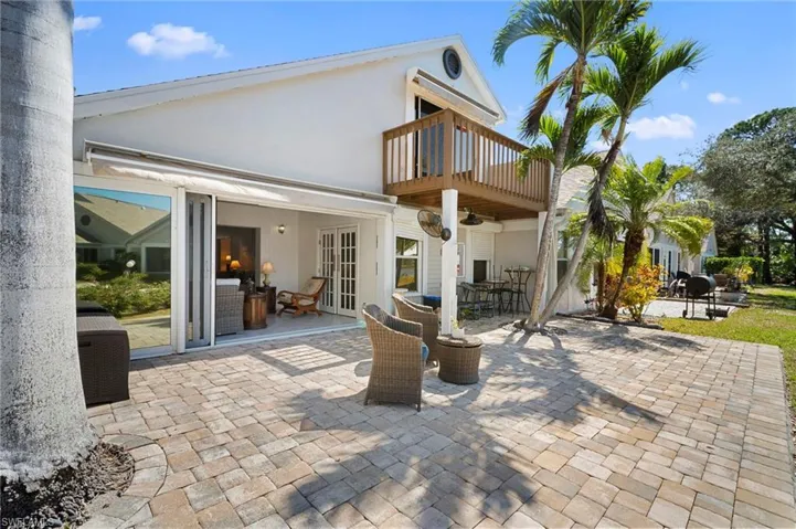 View of patio with french doors and outdoor dining space