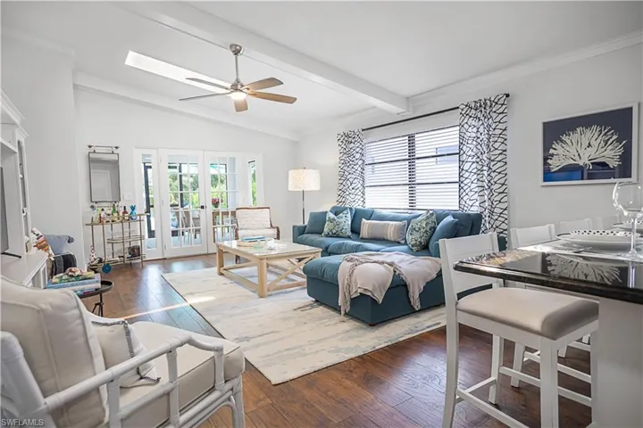 Family Room with Vaulted Ceiling, Skylights and French Doors to Screened Lanai
