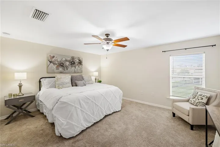 Spacious Primary suite with plenty of room for a king bed and a sitting area