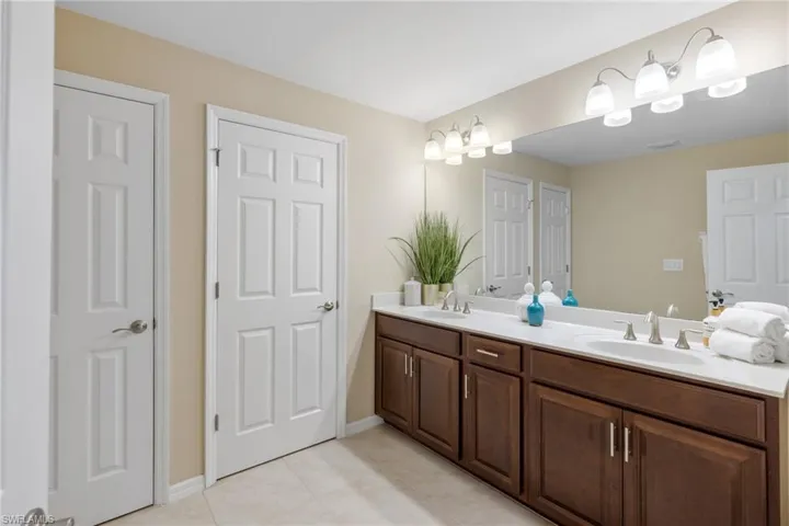 Door on the left is a linen closet and the door on the right is a private water closet