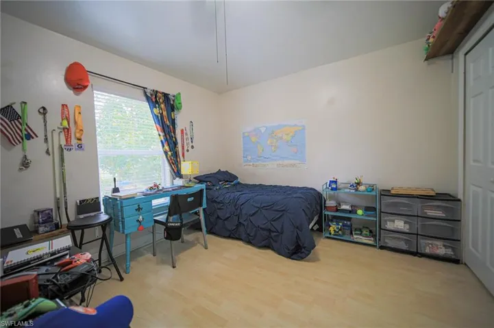 Bedroom with wood finished floors