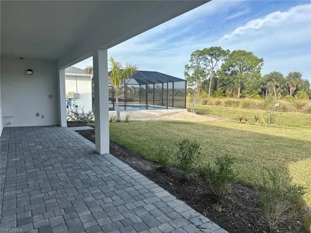 Backyard patio with exterior privacy wall dn pre-plumbing for future outdoor kitchen