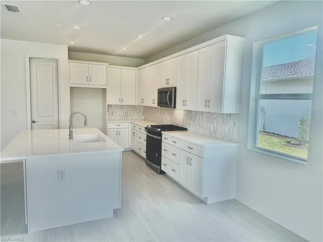 Kitchen layout with stainless steel appliances