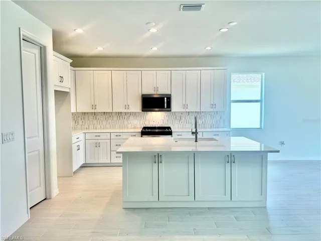 Kitchen layout with stainless steel appliances