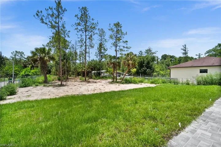 View of yard featuring view of wooded area