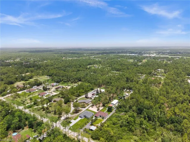 Aerial overview of property's location with a forest