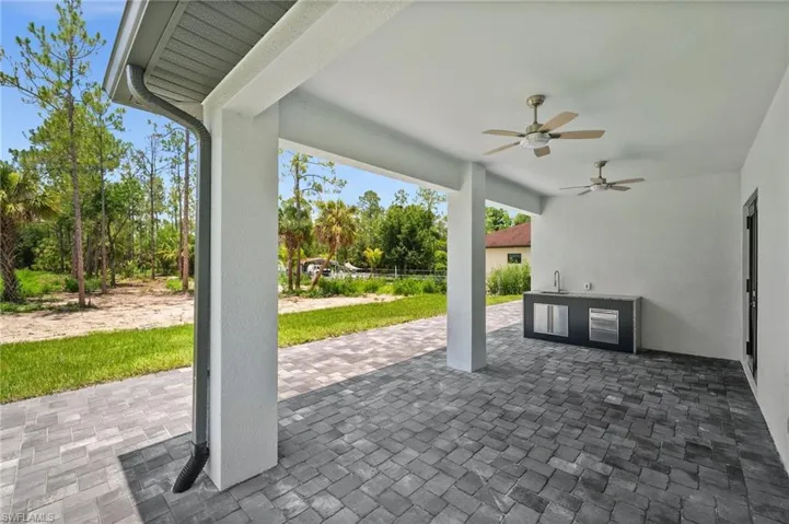 View of patio / terrace featuring a ceiling fan and exterior kitchen