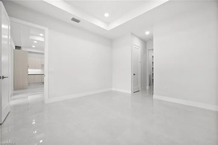 Empty room featuring recessed lighting