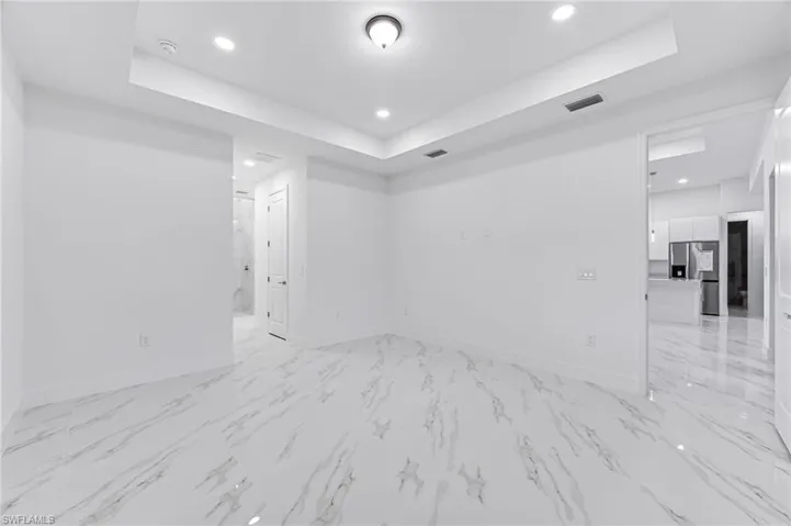 Spare room with a tray ceiling
