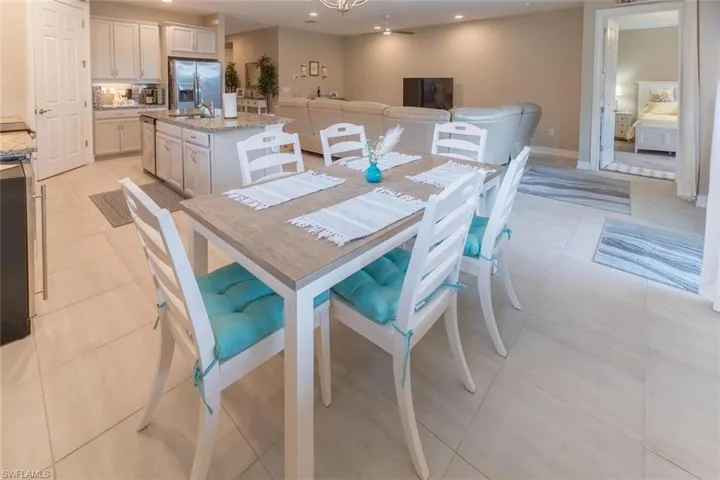 Dining room featuring sink and light tile floors