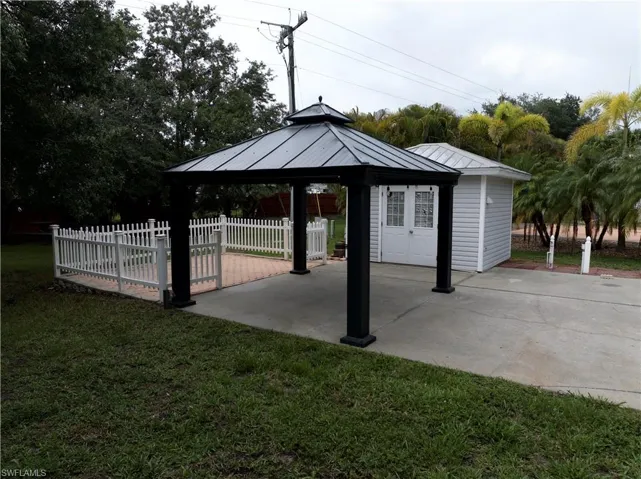 Surrounding community with a gazebo and a patio area